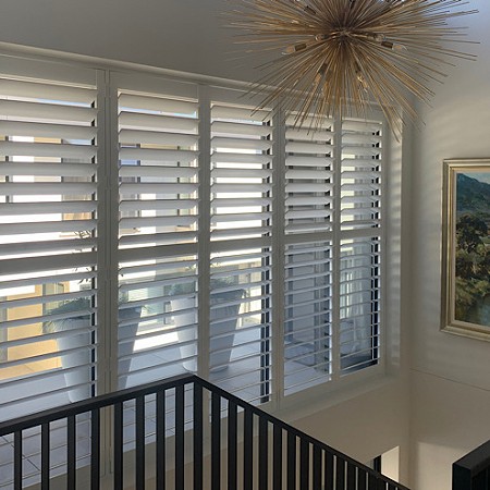 Shutters installed in Stairwell create a fashion statement. By Betta Blinds.